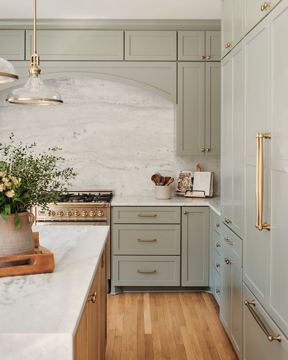 sage green kitchen, sage green cabinets, gold kitchen hardware, brass kitchen hardware, quartz countertops, marble counters, green kitchen